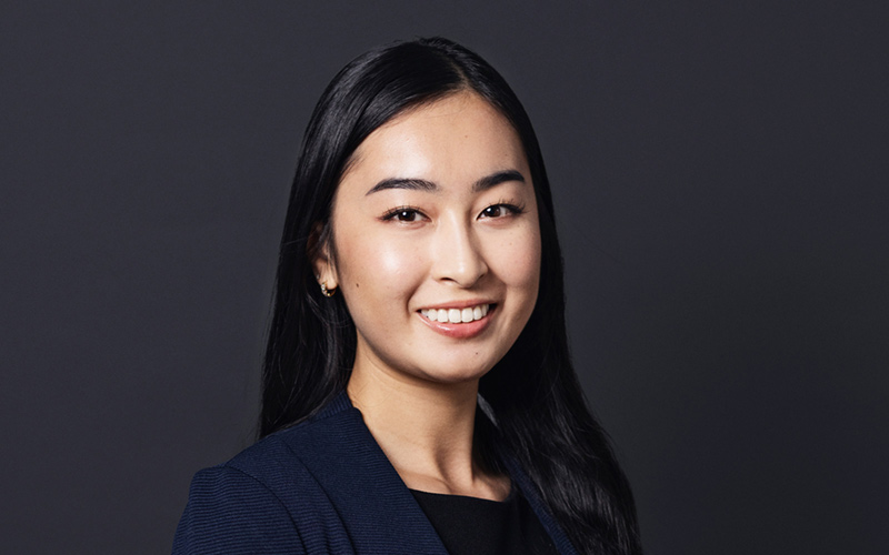 Portrait of expert Vivian Nhu Vu Bui on dark grey background